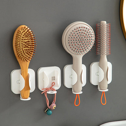 Wall-mounted gravity-sensor electric toothbrush holder, no drilling required, multi-functional toothpaste and comb holder for bathroom use.